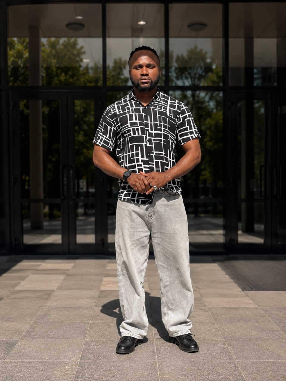 Nwachukwu Austine standing outside a modern building