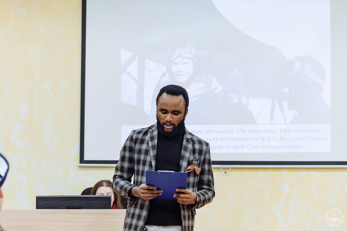 Austine presenting at a university event
